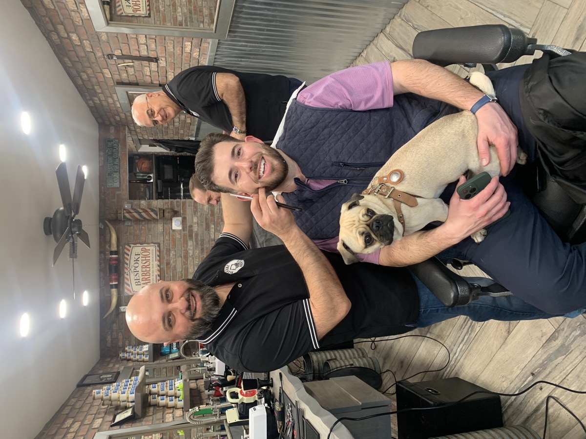 Client with his pug dog in the Bespoke Barber chair. Everyone is welcome.